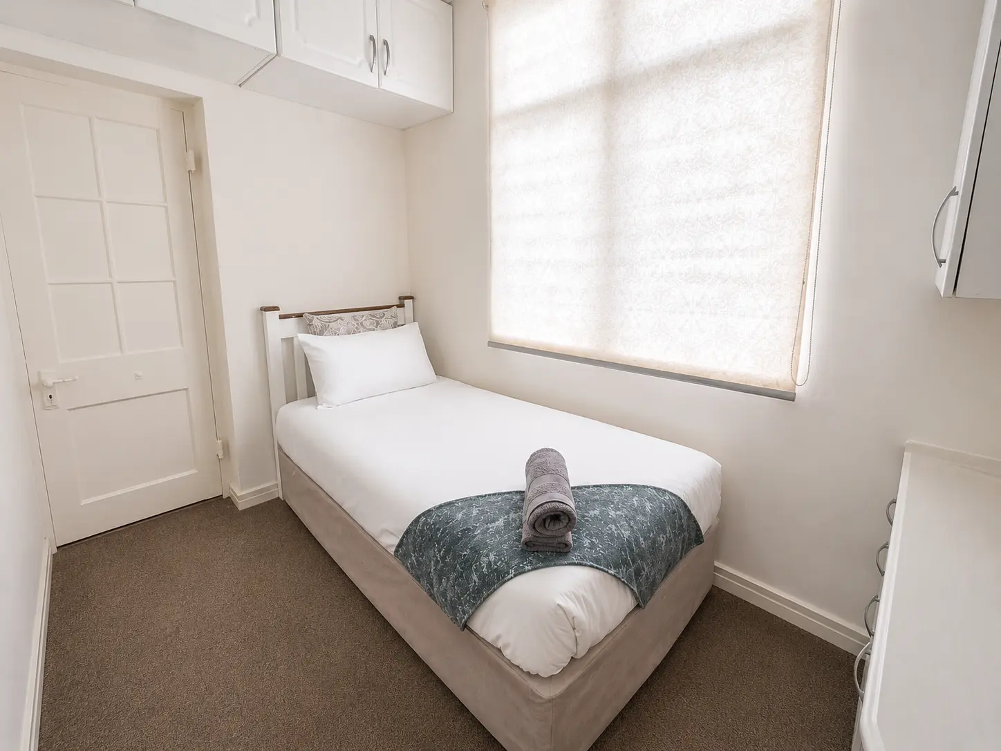 Single bed room with storage